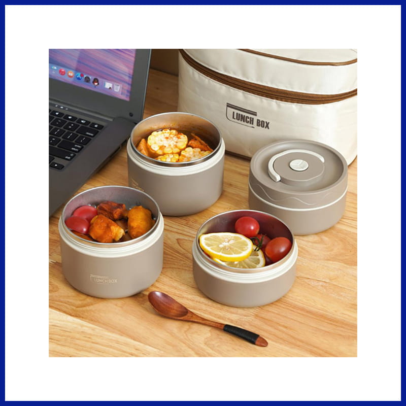Four Lunch Boxes with Snacks by Laptop